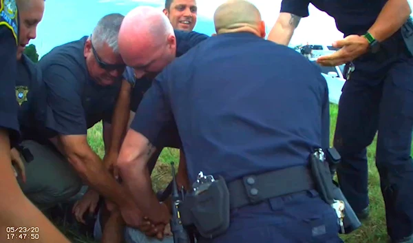 May 23, 2020 image from Franklin Parish Sheriff's Office body camera video, law enforcement officers restrain Black motorist Antonio Harris on the side of a road in Franklin Parish, Louisiana.