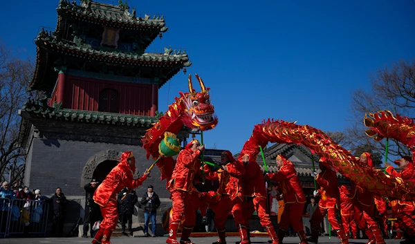 Chinese dragon dancers perform at the Dongyue Temple on the first day of the Chinese Lunar New Year in Beijing, Saturday, Feb. 10, 2024(AP)