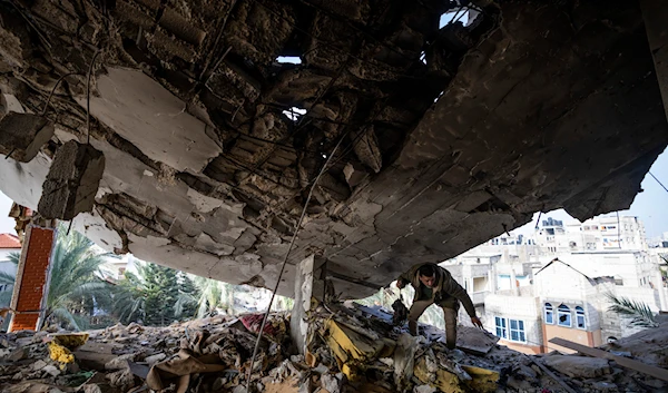 A Palestinian salvages belongings after an Israeli strike in Rafah, Gaza Strip, Saturday, Feb.10, 2024(AP)