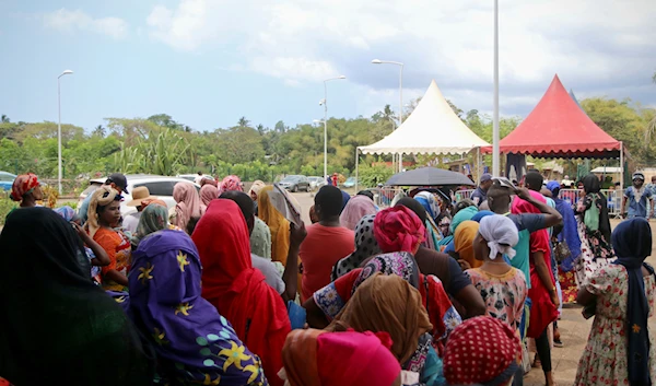 Residents queue for water in Tsoundzou, on the French Indian Ocean Island Mayotte, Saturday, Oct. 21, 2023(AP)