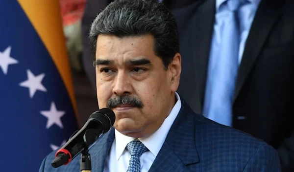 Venezuelan President Nicolas Maduro speaks with the press after holding a meeting with FIFA president Gianni Infantino at the Miraflores Presidential Palace in Caracas, on October 15, 2021. (AFP via Getty Images)