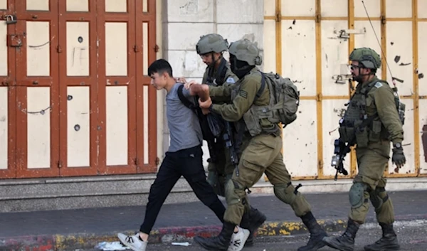 Illustrative: Israeli occupation forces detain a Palestinian youth in the city of al-Khalil in the occupied West Bank on September 29, 2022. (AFP)