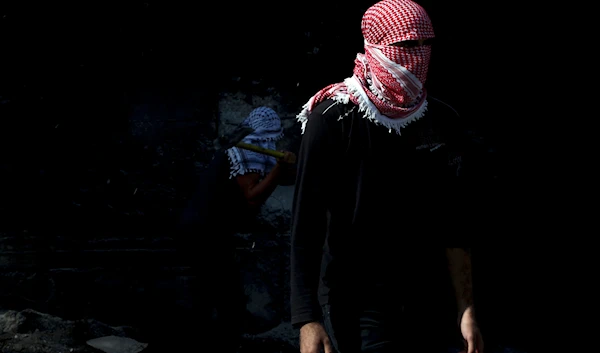 A Palestinian student stands during a protest at the separation barrier between the West Bank and Israel in Abu Dis Monday, Nov. 2, 2015. (AP)