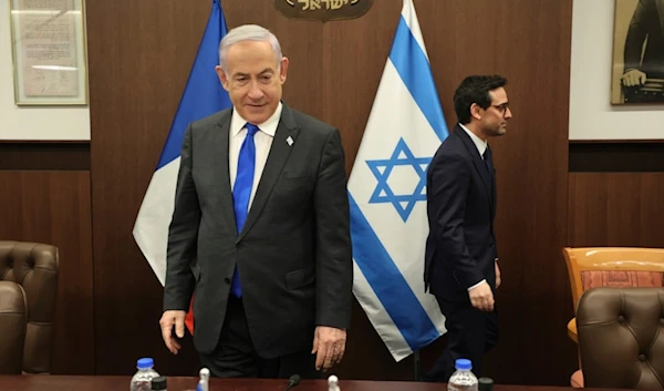 Israeli Prime Minister Benjamin Netanyahu, left, takes a seat before his meeting with France's Foreign Minister Stephane Sejourne, right, in occupied Al-Quds, Monday, Feb. 5, 2024. 5, 2024. (AP)