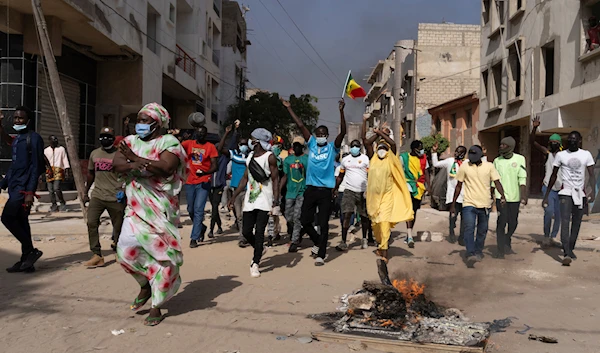 Demonstrators protest President Macky Sall decision to postpone the Feb. 25 vote, citing an electoral dispute between the parliament and the judiciary regarding some candidacies in Dakar, Senegal, Friday, Feb. 9, 2024. (AP)