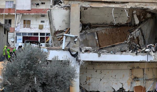 Civil defense and rescue workers remove rubbles from a building that was attacked Wednesday night by an Israeli airstrike, in Nabatieh town, south Lebanon, Thursday, Feb. 15, 2024(AP)