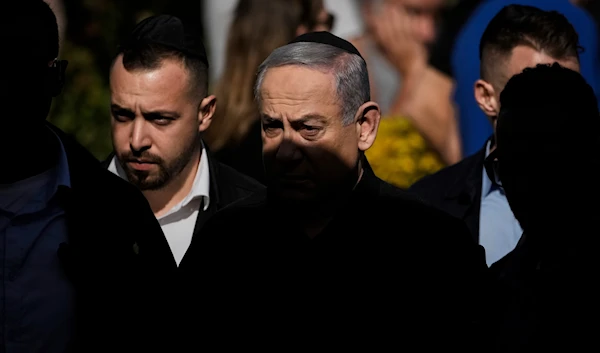 Israeli Prime Minister Benjamin Netanyahu at the military cemetery in 'Herzliya', occupied Palestine, December 8, 2023 (AP)