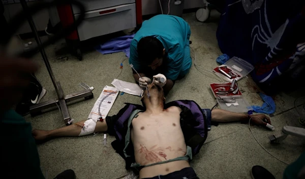 A Palestinian wounded in the Israeli bombardment of the Gaza Strip receives treatment at the Nasser hospital in Khan Younis, Southern Gaza Strip, Monday, Jan. 22, 2024. (AP)