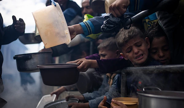 Palestinians line up in Rafah, Gaza on Friday, Feb. 16, 2024. (AP)