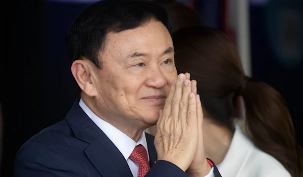 Thailand's former Prime Minister Thaksin Shinawatra greets supporters on his arrival at Don Muang airport in Bangkok, Thailand, on Aug. 22, 2023. (AP)