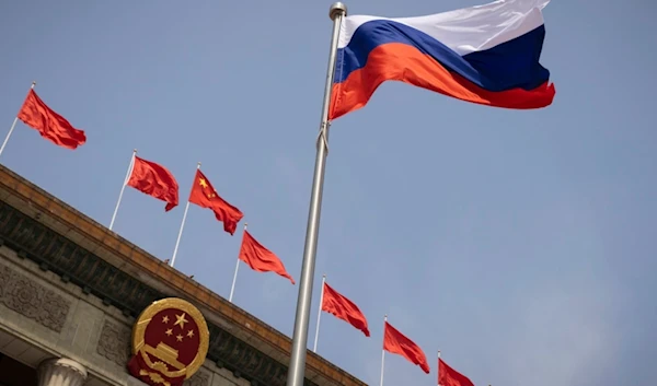 The Russian national flag flies in front of the Great Hall of the People before a welcoming ceremony for Russian Prime Minister Mikhail Mishustin in Beijing, China, Wednesday, May 24, 2023. (AP)