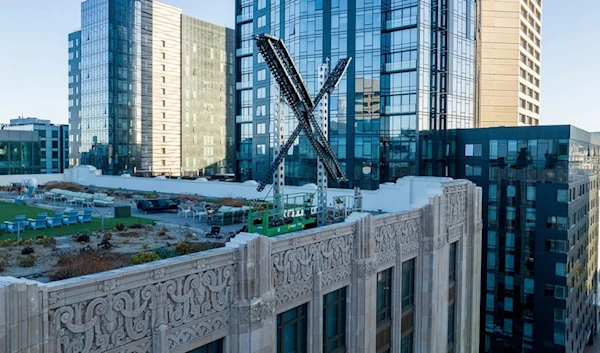 An "X" sign rests atop the company headquarters, formerly known as Twitter, in downtown San Francisco, on Friday, July 28, 2023 (AP)