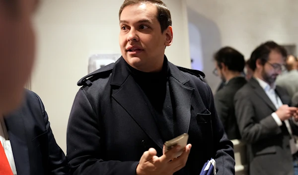 Former Rep. George Santos, R-N.Y., arrives before Republican presidential candidate former President Donald Trump speaks at a primary election night party in Nashua, N.H., January 23, 2024. (AP)