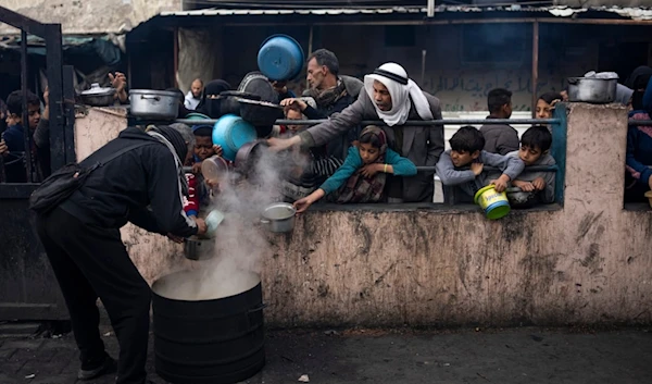 Palestinians line up for a meal in Rafah, Gaza Strip, Friday, Feb. 16, 2024. (AP)