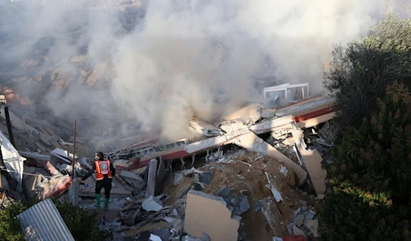 Palestinian emergency services look for survivors after an Israeli strike on a residential building in Rafah, Monday, Feb. 19, 2024. (AP Photo/Hatem Ali)