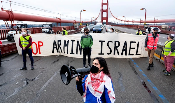 Aysha Abraibesh leads a chant while as pro-Palestinian demonstrators block commute traffic on the Golden Gate Bridge on Wednesday, Feb. 14, 2024, in San Francisco.(AP)