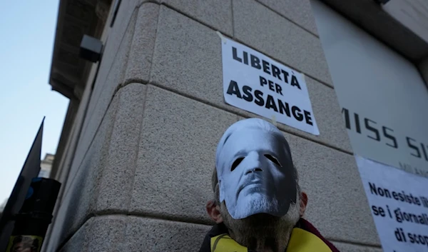 Pro-Assange activists demonstrate outside of the British Consulate in Milan, northern Italy, Tuesday, Feb. 20, 2024. (AP)