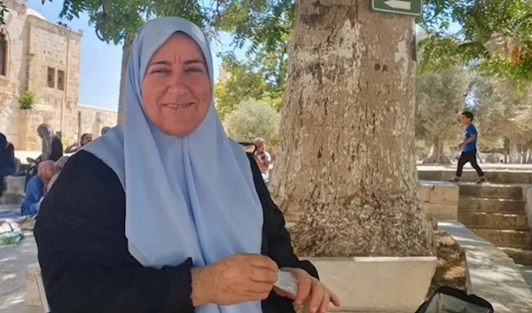 In an undated image we see Dalal Suleiman, sister of martyred Hamas deputy chief Saleh al-Arouri, sitting in the yard outside of al-Aqsa Mosque. (Social media)