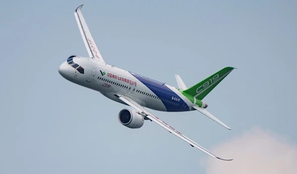 A China's COMAC C919 aircraft flies during the first day of the Singapore Airshow in Singapore, Tuesday, Feb. 20, 2024. (AP)