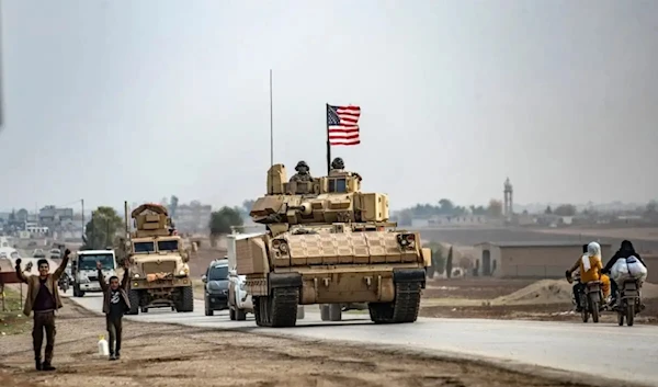 US troops patrol in their military vehicles near the Syrian border on December 17, 2020. (AFP)