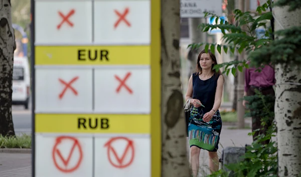 A billboard for an exchange office indicates it only performs transactions for Russian rubles in Donetsk, Ukraine, Friday, May 30, 2014. (AP)