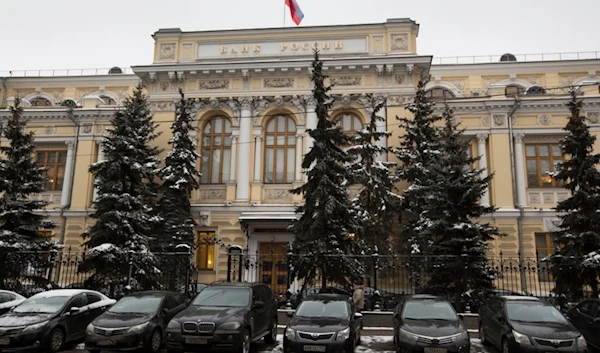 Cars are parked in front of Russia's Central Bank building in Moscow, Russia, Friday, Jan. 30, 2015.  (AP)