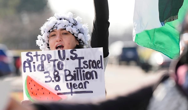 Amana Ali joins about three dozen people protesting Israel's attacks in Gaza, Thursday, Feb. 8, 2024 in Dearborn, Mich. (AP)