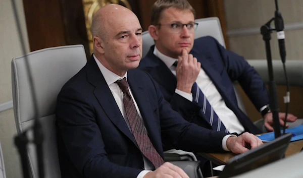 Russia's Finance Minister Anton Siluanov, left, attends a session at the State Duma, the Lower House of the Russian Parliament in Moscow, Russia, on Friday, Nov. 17, 2023. (AP)