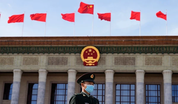 A Chinese soldier stands guard outside the Great Hall of the People after the opening ceremony of The Third Belt and Road Forum at the Great Hall of the People in Beijing, Wednesday, Oct. 18, 2023.