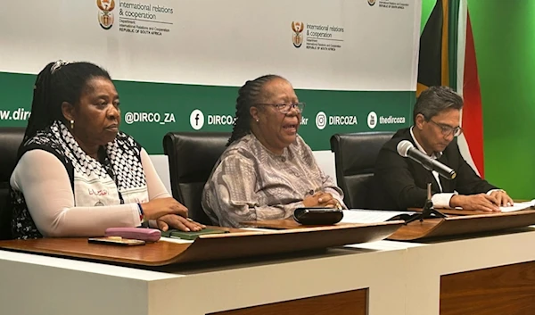 South African Foreign Minister Naledi Pandor, center, adresses a news conference in Pretoria, South Africa, Wednesday, Jan. 31, 2024 (AP Photo/Sebabatso Mosamo)