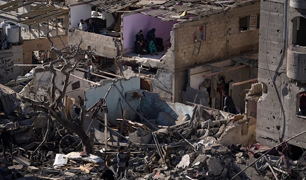 Palestinians look at the destruction after an Israeli strike on residential buildings and a mosque in Rafah, Gaza Strip, Thursday, Feb. 22, 2024.(AP)