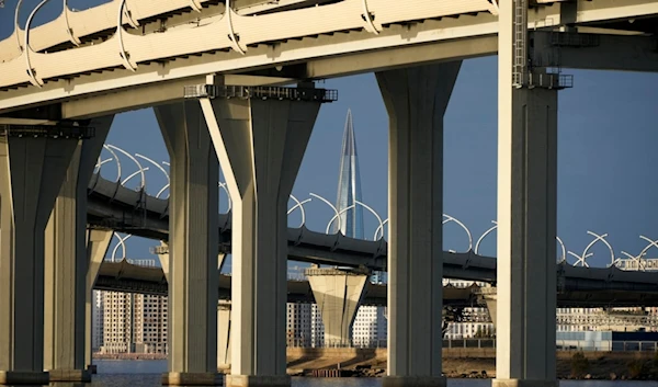 The headquarters of Russian gas monopoly Gazprom skyscraper is seen behind a Western Speed Diameter highway bridge in St. Petersburg, Russia, Tuesday, Oct. 10, 2023. (AP Photo/Dmitri Lovetsky)