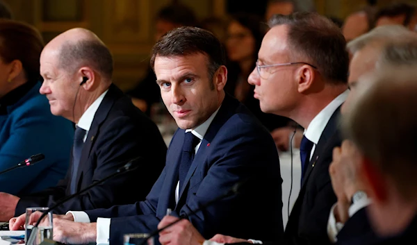 French President Emmanuel Macron, center, delivers a speech at the Elysee Palace in Paris, Monday, Feb. 26, 2024. (AP)