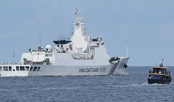 This photo taken on August 22, 2023 shows a Chinese coast guard ship (L) in the South China Sea (AFP/Getty Images)