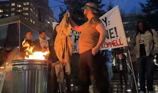 At a vigil honoring Aaron Bushnell in Oregon, US veterans were seen burning their military uniforms in a tribute to the former US airman and in rejection of US complicity in the Israeli genocide in Gaza. (Screen grab, social media)