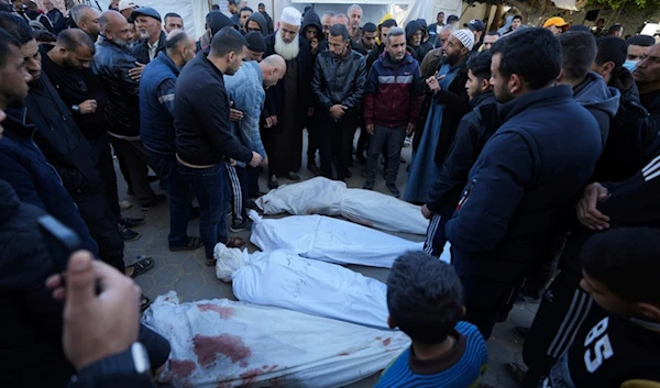 Palestinians mourn their relatives killed in the Israeli bombardments of the Gaza Strip in front of the morgue of the Al Aqsa Hospital in Deir al Balah, on Thursday, Feb. 29, 2024. (AP Photo)