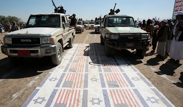 Resistance fighters stage a rally against the US government designating Ansarallah as a terror group and against the US aggresion on Yemen, near Sanaa, Yemen, Thursday, Jan. 25, 2024. (AP Photo)