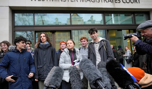 Environmental activist Greta Thunberg, centre, speaks to the media at Westminster Magistrates Court in London, Friday, Feb. 2, 2024. (AP)