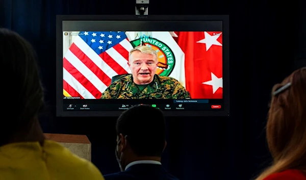 General Frank McKenzie, then-Commander of US Central Command, appearing on screen from MacDill Air Force Base, in Tampa, Fla., speaks about Afghanistan during a virtual briefing at the Pentagon in Washington, Monday, Aug. 30, 2021. (AP