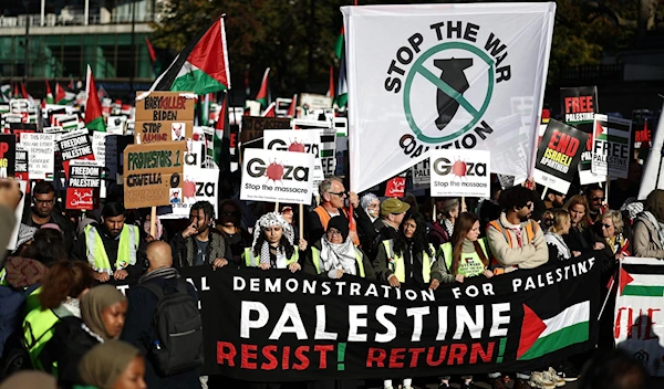 Pro-Palestinian, anti-Israel protesters gather with placards and flags at a 'National March For Palestine' in London on November 11, 2023 (AFP)