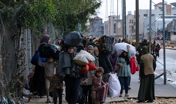 Palestinians flee from the city of Khan Younis in southern Gaza after an Israeli ground and air offensive on Monday, Jan. 29, 2024(AP)