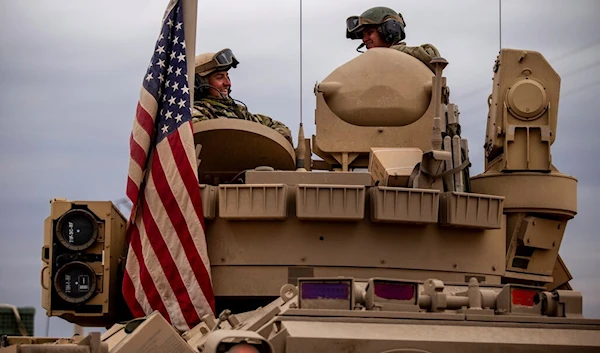 US soldiers sit in a fighting vehicle in Hassakeh, Syria, Tuesday, Feb. 8, 2022. (AP)