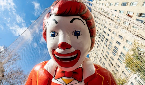 The Ronald McDonald balloon floats above the road during the balloon inflation for the 97th Macy's Thanksgiving Day Parade in New York, Wednesday, Nov. 22, 2023. (AP Photo/Peter K. Afriyie)