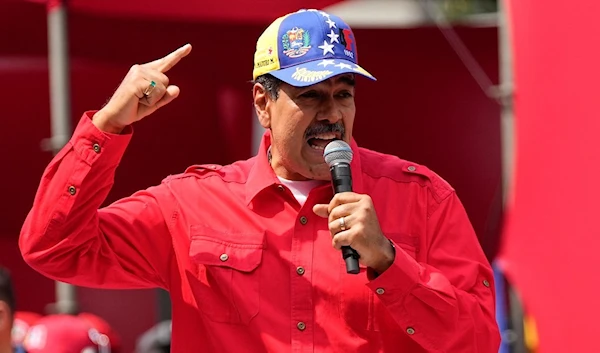 Venezuela's President Nicolas Maduro speaks to supporters during an event marking the anniversary of the 1992 failed coup led by late President Hugo Chavez, at the Miraflores Presidential palace in Caracas, Venezuela, Sunday, Feb. 4, 2024. (AP)