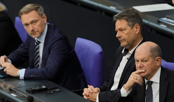 German Chancellor Olaf Scholz, Economy and Climate Minister Robert Habeck and Finance Minister Christian Lindner at the Bundestag in Berlin, Germany, Nov. 28, 2023. (AP)