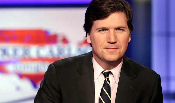 Tucker Carlson, host of "Tucker Carlson Tonight," poses for photos in a Fox News Channel studio, March 2, 2017, in New York.