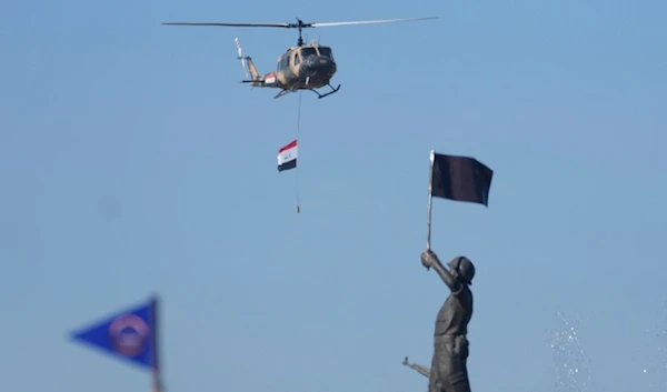 An Iraqi Army helicopter is seen during the Army Day celebrations in Baghdad, Iraq, Saturday, Jan. 6, 2024. The Iraqi Army was activated on Jan. 6, 1921, while under British rule. (AP Photo)