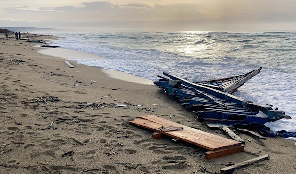 A view of part of the wreckage of a capsized boat that was washed ashore at a beach near Cutro, southern Italy, on Feb. 27, 2023(AP)