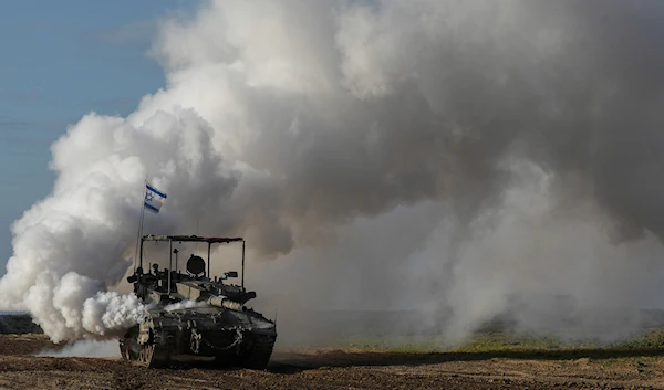 An Israeli army tank moves near the Gaza Strip, in southern occupied Palestine, Wednesday, Jan. 24, 2024 (AP)