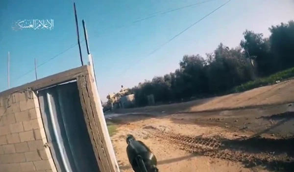 A screengrab from a video posted by Al-Qassam Military Media depicting one of its fighters firing an RPG at an Israeli tank (Military Media)